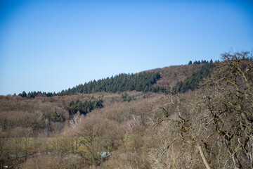 Rolling Hills and Green Fields Under a Clear Sky. A stunning countryside landscape featuring...