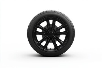 Obraz premium A black modern car wheel stands against a white background