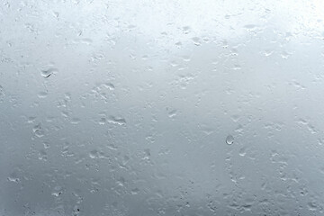Raindrops on window glass. Rainy weather.