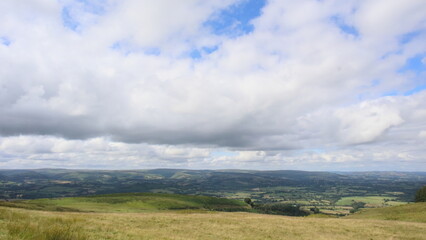 Rolling Hills Under Clouds