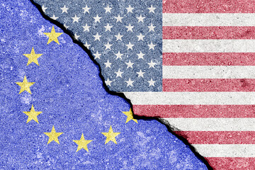 The crack between the flags of the United States and the European Union. The concept of problems in...