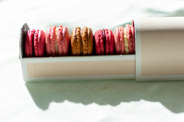 French fruity macaroons in red and pink.
