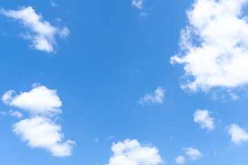 Low angle view of beautiful blue sky with strange shape of fluffy white clouds in the morning or evening in sunny day used as natural background texture in decorative art work