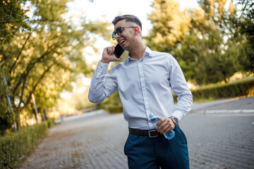 Man Standing on a Street Talking on a Cell Phone