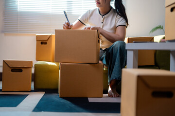 Startup small business entrepreneur or freelance woman working at home checking order