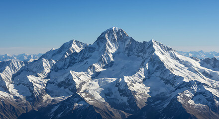 Obraz premium Majestic Snowy Mountain Range Against Blue Sky