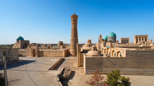 Aerial view of the Po-i-Kalyan complex made of the Kalan Mosque, the Kalyan Minaret and the Mir-i Arab Madrasah in the historic old town of Bukhara in Uzbekistan, Central Asia