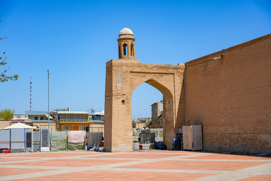 Archway at the corner of the Kalan Mosque on Persian Square in the historic old town of Bukhara in Uzbekistan, Central Asia