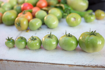 Pile of raw natural green tomatoes