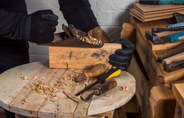 Various construction tools with hand tools for home renovation on wooden board