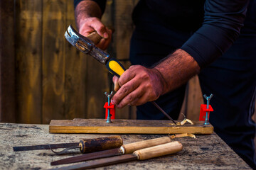 The carpenters are using spokeshave to decorate the woodwork.