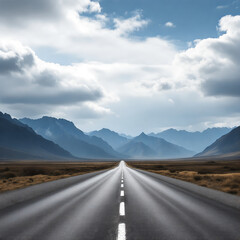 Naklejka premium Long Straight Highway Stretching Towards Distant Mountains