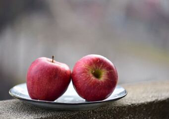 red apples on a plate