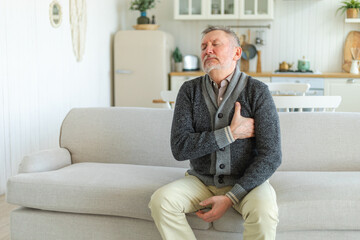 Pain on heart, heart attack. Unhappy middle aged senior man suffering from chest pain heart attack...