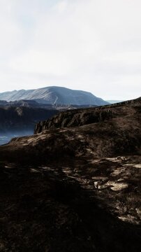 black volcanic basalt rock formations in the low light