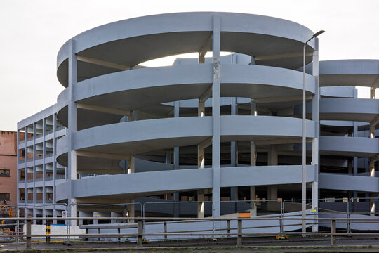 Construction Site of Double Spiral Multi-Story Gray Concrete City Center Car Park - Powered by Adobe