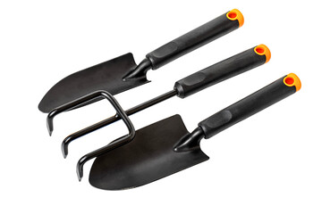 Gardening tools set with trowel, hand rake and cultivator lying on white background