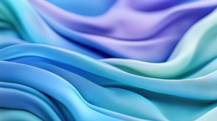 Obraz premium Blue fabric waves creating a soft and smooth texture in varying shades of blue and green tones