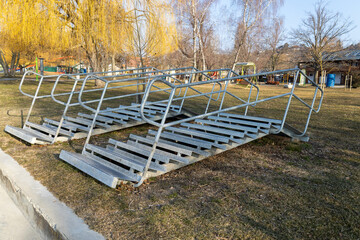A metal staircase pulled ashore in winter, leading into the lake in summer.