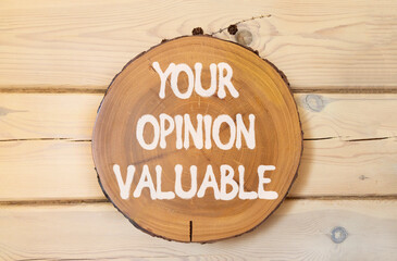 Your opinion valuable symbol. Concept words Your opinion valuable on beautiful wooden circle....