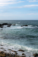 seascape with rocky seaside and surf
