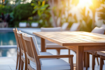 Poolside dining area with modern wooden furniture.