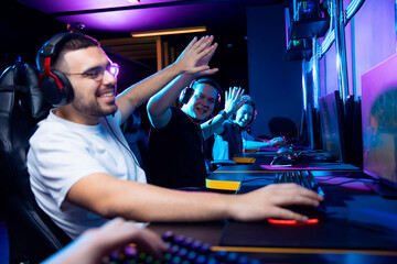 Young diverse friends enjoying esport gaming session together
