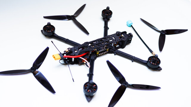 FPV drone in production on white background.