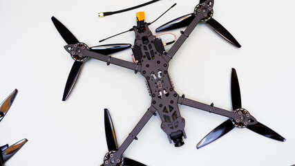 FPV drone in production on white background.