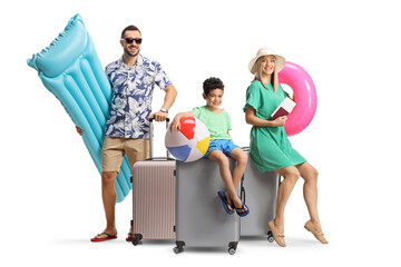 Happy family with suitcases packed for a summer vacation