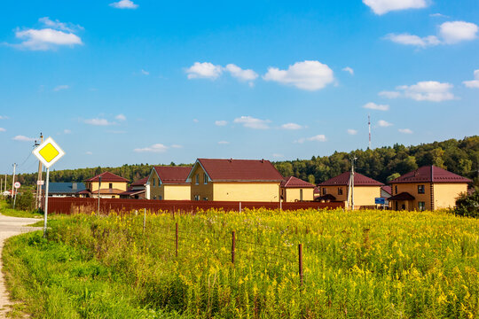 Brick houses of the same type built in a rural village, Russia