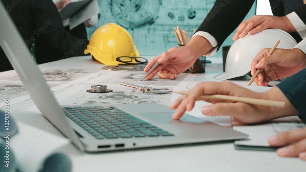 Poster a group of engineers engages in a detailed planning session around blueprints and technical drawings