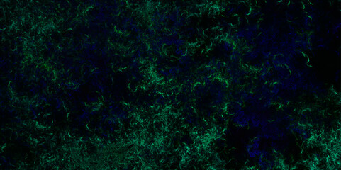 Smooth grungy abstract smokey light green colors ink glow in a dark background. Green dust overlay particle abstract grunge texture on dark background. Black and green grunge on a dark design.