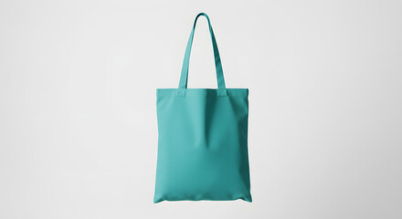 Teal totebag hanging white backdrop bright studio lighting mockup clean sharp canvas totebag