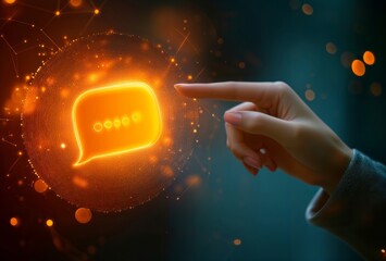 AI communication concept. Glowing orange chat bubble with digital particle effects being touched by human hand against dark turquoise background.