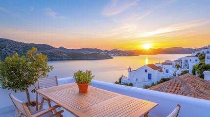 Fototapeta premium Sunset view over tranquil bay with wooden table and potted plant
