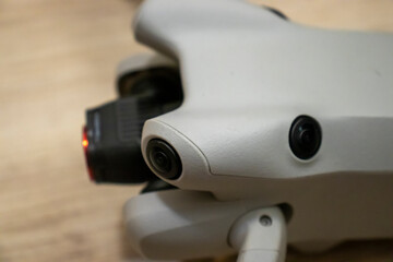 Close-up of a drone camera showcasing its intricate design and advanced technology. Perfect for tech enthusiasts and photographers.