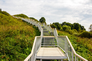 Stairs going up the slope in the territory of the landscape park. Borovsk, Russia