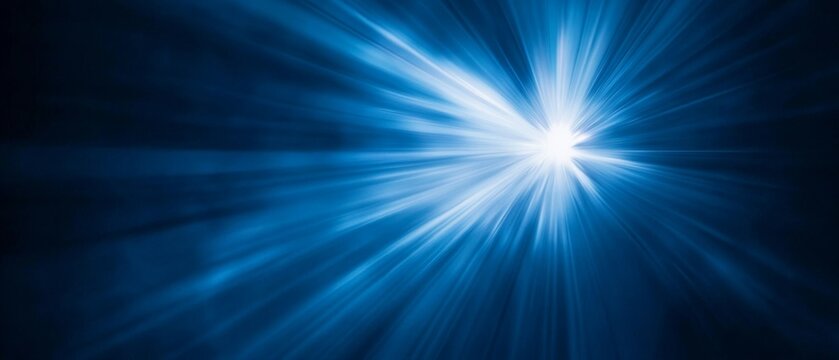 A black background with a beam of bright blue light. Bright blue beam of light cutting through the darkness creating a visual energy effect.