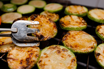 Grilled vegetables cooking on a barbecue grill in a backyard setting