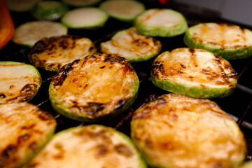 Grilling fresh zucchini slices for healthy summer meals
