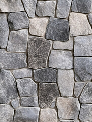 Natural stone wall with varying textures and shades in a modern design