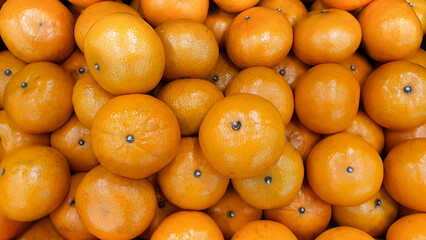 Top view oranges are sold in fruit market.