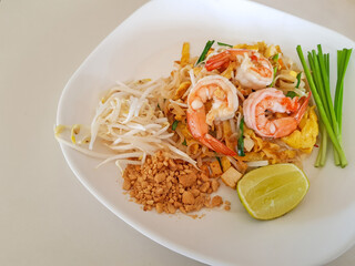 Close up Pad Thai Goong Sod, Fried Rice Sticks with Shrimp or Thai noodle shrimp, Popular Thai food in Thailand. Top view concept illustration for restaurant menu.
