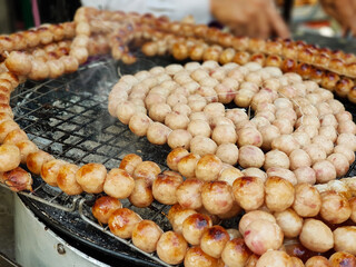 Close-up sausage grilled (Sai Krok Isan) Thai traditional style, Sai krok isan, pork and rice, thai street food market, Street food in Thailand.