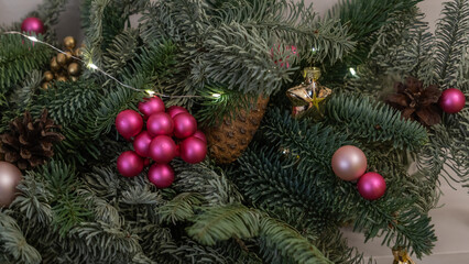 Christmas and New Year background. Christmas tree branch with hanging ball.