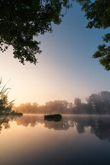 sunrise over the foggy river