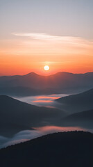 Fototapeta premium Sunrise over the mountains, with mist rising from below and the sun at the center 