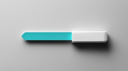 Turquoise nail file with white handle on gray surface