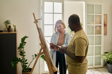 Smiling Artists Enjoying Creative Painting Session Together